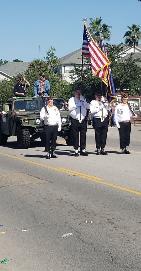 Mike Robinson marches with the Mississippi State Honor Guard in the d’Iberville Veterans Day Parade.