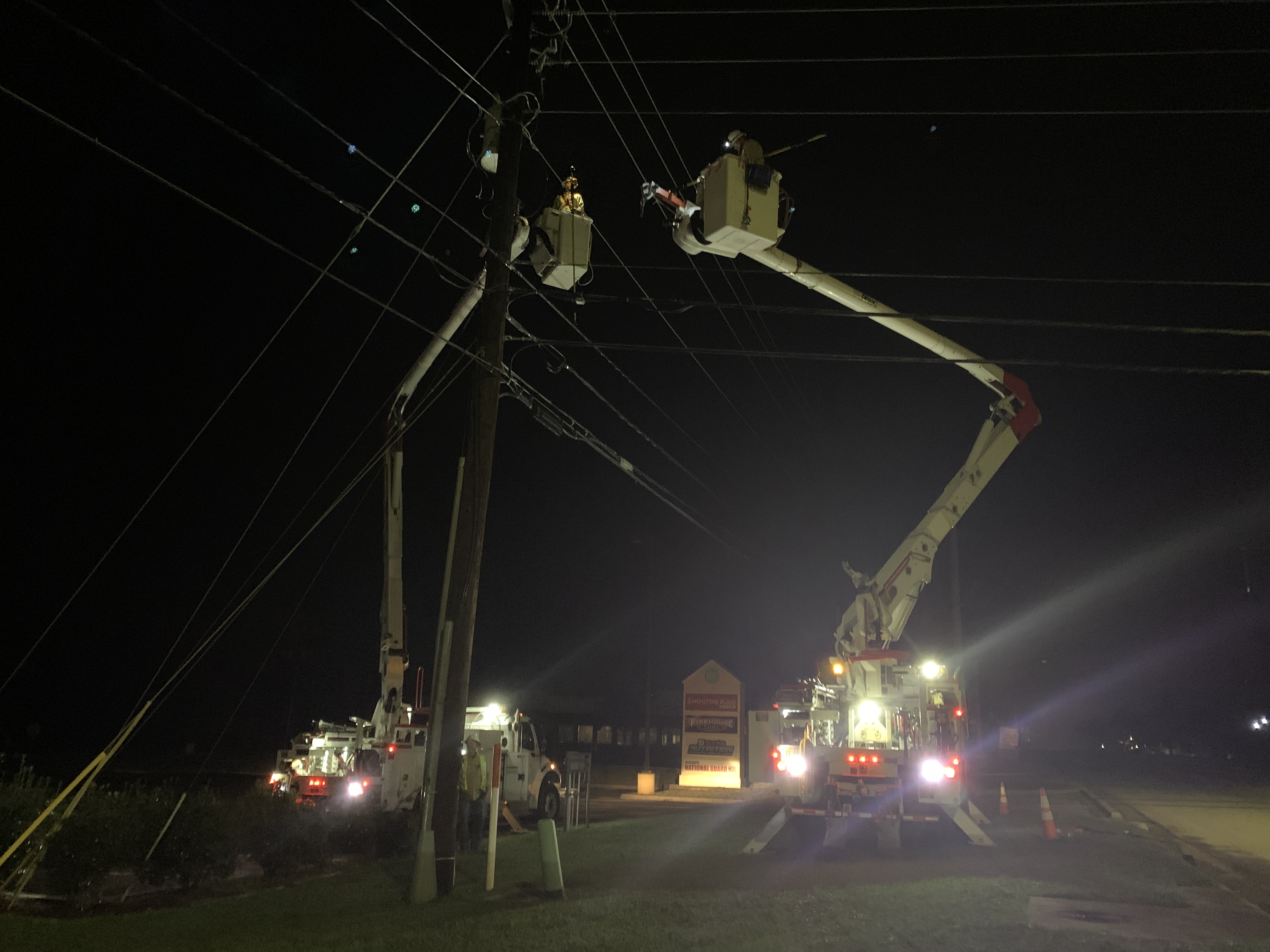 Mississippi Power linemen work on Hwy. 49 in Gulfport to restore service to Singing River Gulfport.