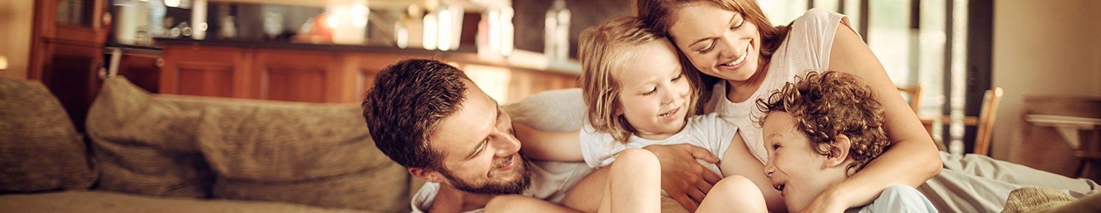 Family of Four Relaxing on Couch