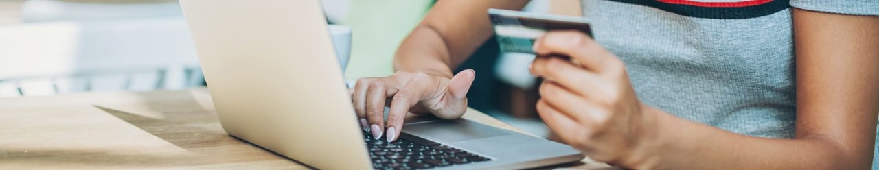 Woman entering credit card information online