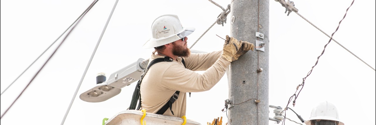 Lineman Working on a Power Distribution Pole