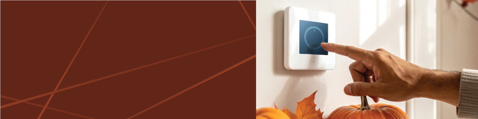 Man's hand adjusting a smart thermostat