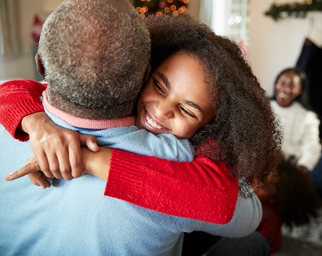 Granddaughter hugging her grandfather