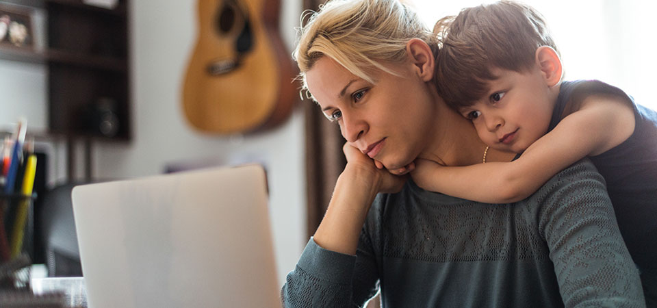 woman and child looking at computer