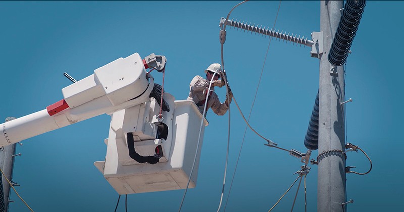 lineman installing Grid investment 